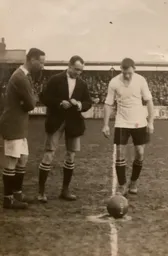 Alf Tirrell looks at how the coin has fallen, observed by Pompey's Arthur Knight