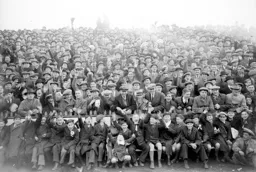 Fans wave to the camera