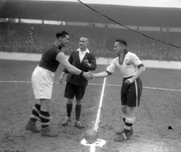 The captains greet each other before the start