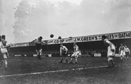 Bert Dawes gets his head to the ball