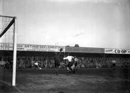 Bill Dolman punches the ball clear