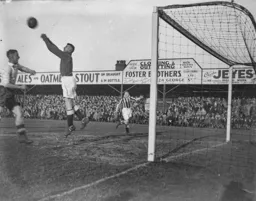 The Blackpool goalkeeper fists the ball clear