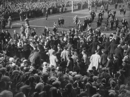 The players are mobbed as they leave the pitch
