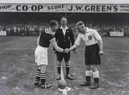 George Stephenson shakes hands with his Villa counterpart