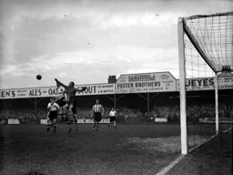The Saints goalkeeper punches clear