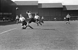 Alan Steen is beaten to the ball