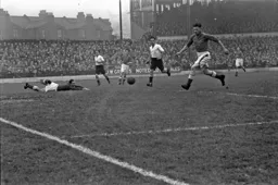 Billy Waugh and Ted Duggan see the ball flash past