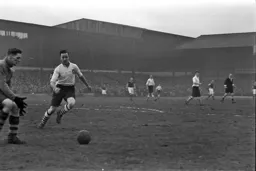 Hugh Billington waits for goalkeeper to slip up