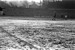 The Kenilworth Road pitch is about to be engulfed in steam from a passing train