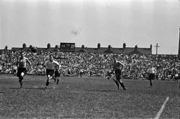 Hugh Billington in a race for the ball