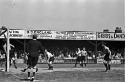 Hugh Billington sees his header tipped over the bar