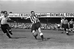 Billy Waugh puts pressure on Newcastle defender Frank Brennan