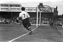 Billy Waugh watches as his cross is converted