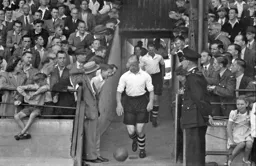 Horace Gager leads out the Luton team