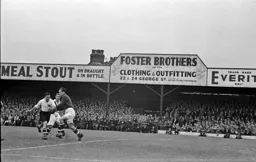 Ted Duggan about to charge the goalkeeper