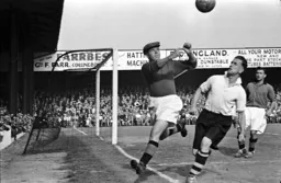 Hugh Billington challnges the goalkeeper