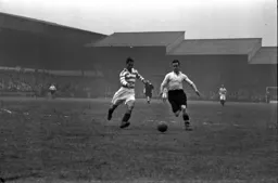 Hugh Billington is challenged by Syd Bycroft of Rovers