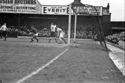 Ted Duggan slams the ball into the net