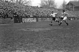 Hugh Billington tries to wriggle down the wing