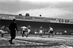 Billy Waugh (11) challenges for the ball