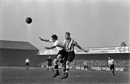 Hugh Billington clashes with a Wednesday defender