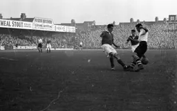 Charlie Watkins jinks through the Bury defence