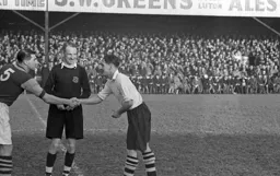 Doug Gardiner shakes hands with his Hammers counterpart