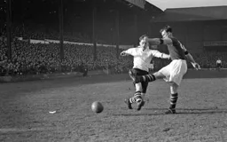 Bobby Brennan tussles with a Hammers defender