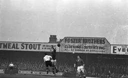 The goalkeeper misses the ball under pressure from Tom Kiernan