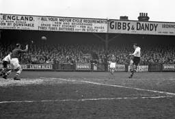 Billy Arnison hammers the ball in