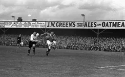 George Stobbart in a race for the ball