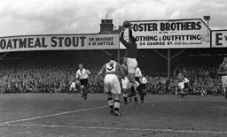 The then record crowd watches on as the Spurs goakeeper Ted Ditchburn gathers the ball