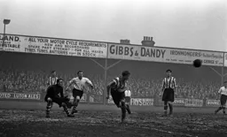 George Stobbart watches the United defender clear the ball