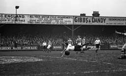 Billy Waugh fails to connect with the ball
