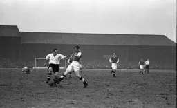 Tom Kiernan is tackled on the edge of the area