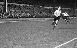 Alec Glover about to control the ball as George Stobbart races into the centre