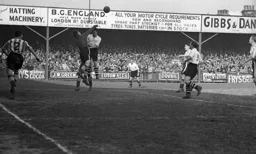 The Bees goalkeeper punches clear