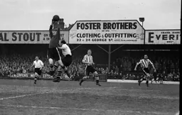 The Brentford keeper safely gathers the ball