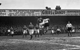 Willie Davie tries to get his head on the ball