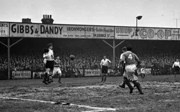 Wally Shanks blocks Pompey's Jimmy Dickinson