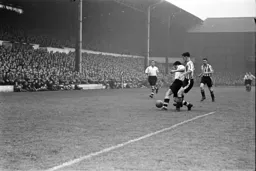 Jack Taylor is closely marked by Brentford's Jimmy Hill
