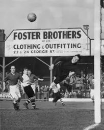 The Everton goalkeeper pushes the ball behind