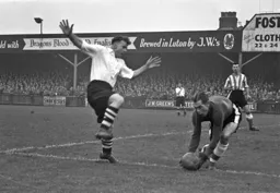 George Stobbart is beaten to the ball