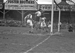 Jack Taylor is beaten to the ball