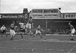 A Blues defender heads clear