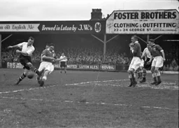 George Stobbart has the ball nicked off his toe