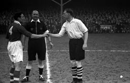Syd Owen shakes hands with his Charlton counterpart Benny Fenton