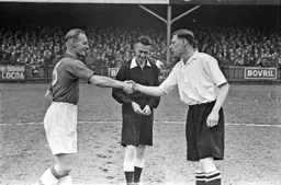 Syd Owen shakes hands with his old team mate Horace Gager