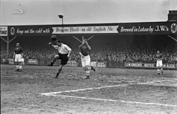 George Stobbart about to head the ball