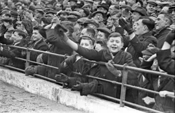 Town fans applaud a goal